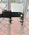 Tough As Nails Double Gate Latch Fits 1-1/4 Inch Chain Link Posts With Heavy Duty Strong Arm And Lock Down Padlock Holes Ready For Ranch Farm Or Backyard Gates In Matte Black, installed on chain link fence.