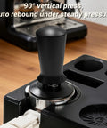 Game Changer 51 Mm Espresso Accessory Bundle featuring a 90° vertical press tamper on a barista station for espresso preparation.