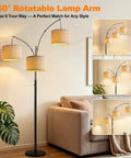 Fully Dimmable Three Light Arc Floor Lamp With Beige Shades in living room next to couch and plant, mid century style