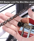 Close-up of 35 chain master link being installed on a mini bike chain, showcasing heavy-duty steel alloy connector for secure fit.