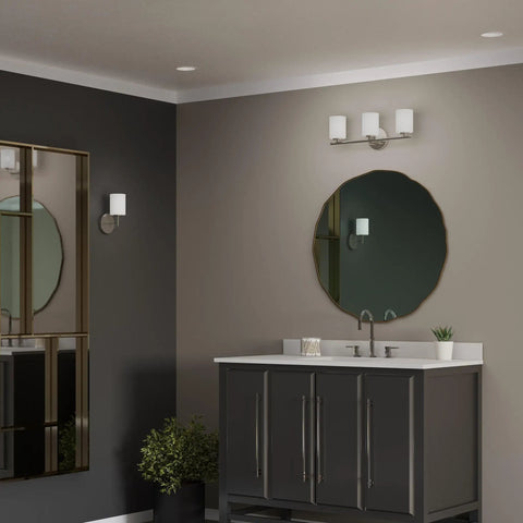 Three Light Etched White Glass Modern Bath Vanity Light with Brushed Nickel Finish in coastal luxury bathroom setting