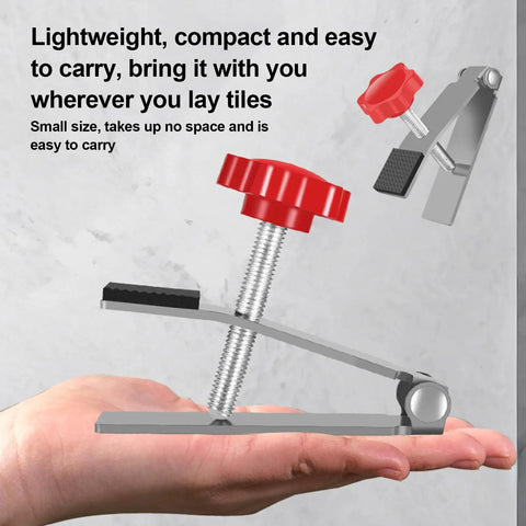 Heavy Duty Tile Lifter With Adjustable Arm Jack And Triangular Load Bearing Base Plus Hassle Free Fine Tune Knobs in hand for portability.