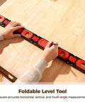 Foldable Level Tool For Woodworking With 180 Degree, 90 Degree, And 45 Degree Bubbles, Pro Grade Multi Function Leveler With Strong Holding Base, ABS Shell, 6 Fold Design, Portable Angle Tool, Unfolds To 28.3 Inches. Hands using foldable level tool on plywood