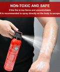 A hand using an 8 Pack Fire Extinguisher Spray Stop Fires Dead Class A B C K with label visible, demonstrating safe use.