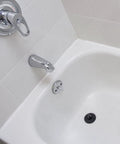 Black drain plug from Four Piece Tub Stopper Set With Hanging Ring Rubber Drain Plugs For Tub Sink Kitchen And Bathroom In Black Fits One And One Eighth To One And Seven Eighths Inch Drains in bathtub