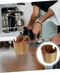 Solid Build Wood Semi Automatic Espresso Grounds Knock Box Splash Shield on countertop with coffee grounds.