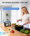 Woman in kitchen using Alexa to view Wireless 2K Doorbell Camera With No Monthly Fees, Ultra Wide View on smart display