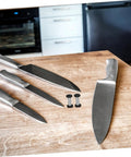 Boss Grade Stainless Steel Knife Handle Screws With Locking Spindle Pins Two Pack Dead Tight Hardware Fresh Finish For Custom Blades Super Install on wooden countertop with kitchen knives.