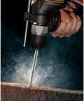 Close-up of Heavy Duty 600 Watt Impact Drill Driver With 13 Mm Keyless Chuck drilling into concrete.