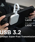 Person using a Magnetic External SSD 1TB For On The Go Storage With MagSafe Portable USB 3.2 Gen 2x2 Drive for fast data transmission.