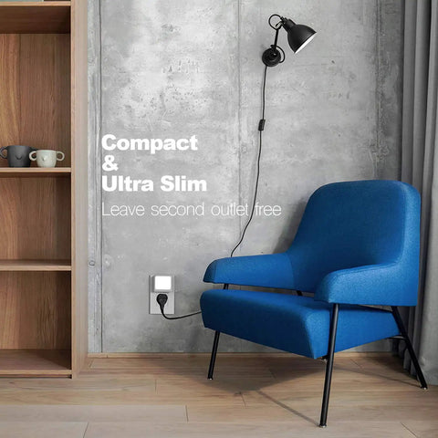 Plug In LED Night Light With Auto Dusk To Dawn Sensor in wall outlet next to blue chair and shelf, showing compact design.