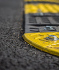 Fender washer stainless steel on a yellow barrier with a bolt