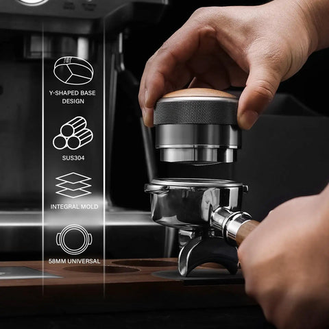 Close-up of hands adjusting a 58mm Espresso Distributor With Adjustable Depth For All 58mm Portafilters Stainless Steel And Walnut Build Y Shaped Base
