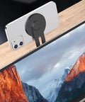 Ultra Thin Aluminum Laptop Phone Holder With Magnetic Quick Mount on laptop edge, holding smartphone, silver color.