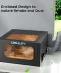 Front view of Creality laser engraver enclosure 2.0 in black with blue logo and orange window, vent hose attached.