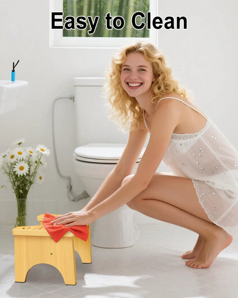 Woman cleaning Eco Friendly Bamboo Toilet Stool Six Point Five Inch for Bathroom Squat Potty with dual anti-slip feet in bathroom.