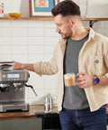 Man using Daily Grind Premium Stainless Steel Espresso Machine With Reliable Built In Grinder And Manual Steam Wand For Killer Lattes.