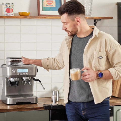 Man using Daily Grind Premium Stainless Steel Espresso Machine With Reliable Built In Grinder And Manual Steam Wand For Killer Lattes.