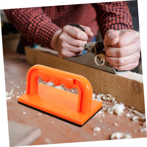 Pro Grade Table Saw Safety Push Block For Woodworking next to woodworker using a hand planer, durable orange push block shown