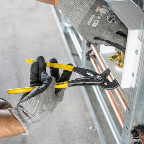 Using 10 Inch Quick Adjust Tongue And Groove Pliers With Push Button Ratchet For Fast Positioning on plumbing fixture