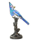 Stained Glass Bird Accent Lamp With Blue Jay Design Tiffany Style Table Lamp 8 W X 13.5 H Inches Bronze Tree Trunk Base Blooming Flowers Vintage Look Cozy Living Room Nightstand Decor, side view of lamp with blue jay on tree base.