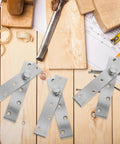 Full Rotation Pivot Door Hinges Set of Four Stainless Steel Hidden Hinges 360 Degree on wooden table with tools
