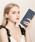 MULE Ultra Slim Wallet For Women Bifold Leather RFID Blocking Designer Card Holder with woman holding blue wallet