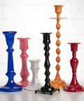 Colorful candlesticks on display. Enhance with Spray On Crystal Clear Acrylic Sealer For Crafts 12 Oz Gloss Finish That Dries Quick.