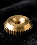 Close-up of a brass nut from the 12 Piece Brass Clock Hand Nut Set For Replacement Hardware 5mm 6mm 10mm OD Threaded Fasteners