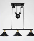 Front view of Three Light Pulley Pendant Island Light With Industrial Vintage Rustic Vibe installed, showcasing adjustable wire design.