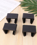 Creative Plastic Sectional Clips For Sofa And Furniture, black rattan connectors shown on wooden surface