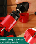 Close-up of red bi-metal hole saw set with mandrels being attached to a drill chuck, 3/4"–2-1/2" range