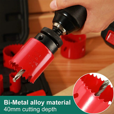 Close-up of red bi-metal hole saw set with mandrels being attached to a drill chuck, 3/4"–2-1/2" range