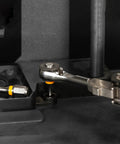 Close-up of Go To One Quarter Inch Hex End EDC Ratchet Wrench For Multitools with hex bit adapters in use on machinery