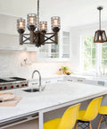 Wood Farmhouse Cage Chandelier Four Light Pendant for Kitchen Island Industrial Chic Dining Table Vintage Edison Ceiling Light Brown and Black Rustic Fixture over modern kitchen.