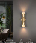 Gold Movie Theater Style Wall Sconce with Up and Down Lighting, mounted on a dark wall in a stylish living room.