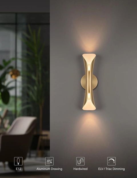 Gold Movie Theater Style Wall Sconce with Up and Down Lighting, mounted on a dark wall in a stylish living room.