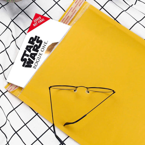 Bubble Mailers 10x13 Inch Padded Envelopes Pack Of 25 with book and glasses on grid background