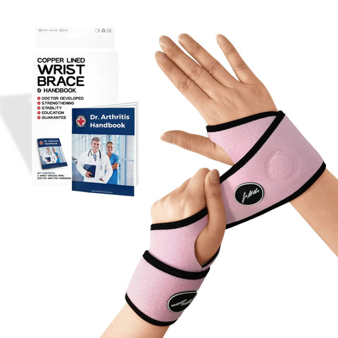 Copper Lined Wrist Support For Carpal Tunnel Arthritis And Tendonitis, No Slip Fit, pink brace shown with handbook
