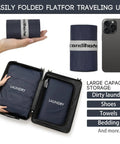 Foldable Waterproof Travel Laundry Bag Set, navy blue wet dry bags folded and packed in suitcase, phone for size reference.