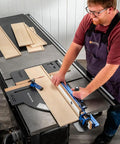 Man using Table Saw Crosscut Sled With Telescoping Fence And Micro-Adjust Flip Stop For Beefy 90-Degree And 45-Degree Cuts.