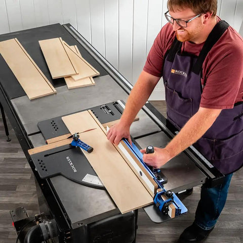 Man using Table Saw Crosscut Sled With Telescoping Fence And Micro-Adjust Flip Stop For Beefy 90-Degree And 45-Degree Cuts.