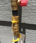 Forty Feet One Half Inch ID Natural Gas Grill Hose With Quick Connect Fittings attached to a gas line wall connection