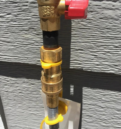 Forty Feet One Half Inch ID Natural Gas Grill Hose With Quick Connect Fittings attached to a gas line wall connection