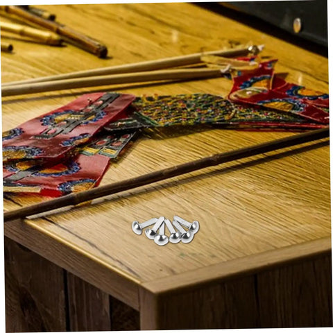 100 Pcs Iron Brads For Paper Crafting And Puppet Making Kit Double Leg Fasteners on a wooden table