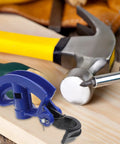 Gleavi Manual Conduit Bender Tool With Steel Bending Head And Spring Hook on workbench with hammer and screwdriver.