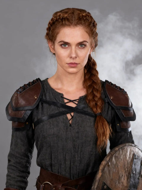 Woman wearing Battle Ready Leather Pauldron Shoulder Armor For Women, Viking Renaissance LARP Cosplay Gear In Brown.