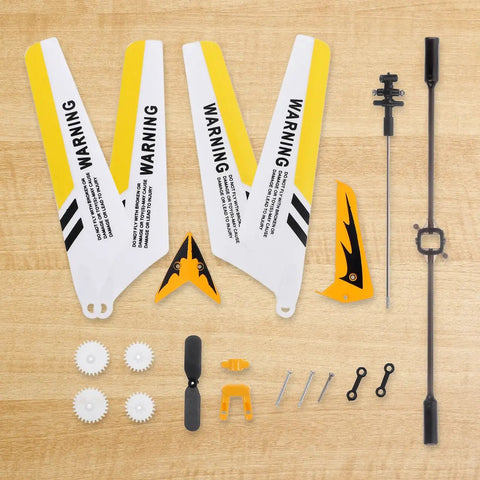 Ultimate Spare Parts Kit for S107 and S107G RC Helicopters in Yellow ABS Plastic and Alloy laid out on a wooden surface