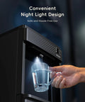Person using the night light feature on a 4 In 1 Water Dispenser With Ice Maker, Hot And Cold Water Cooler, Bottom Loading.