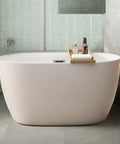 Durable 47 Inch Acrylic Freestanding Bathtub In Gloss White Featuring A Sleek Oval Shape with a wood caddy for bath essentials.